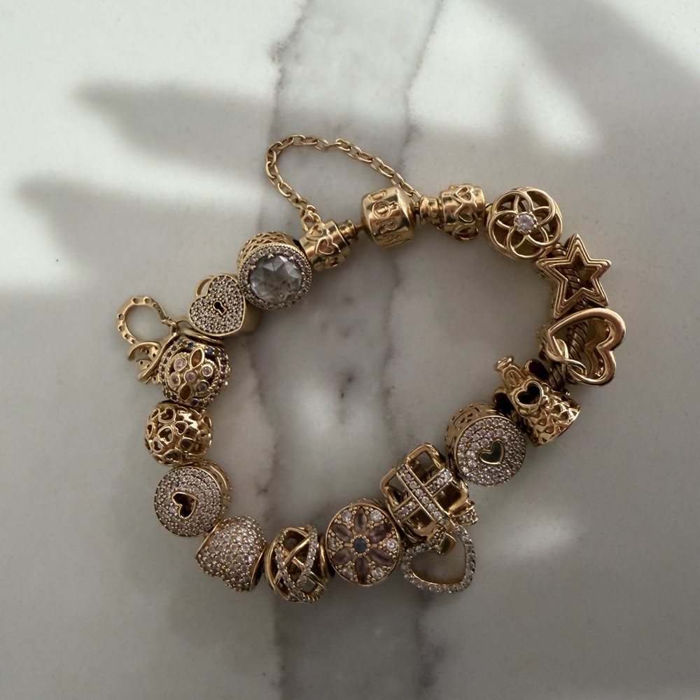 Pandora Gold Charm Bracelet with Intricate Designs